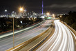 © John - Traffic light trails on the motorway with Auckland CBD in the background