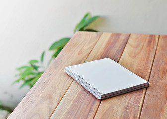empty white paper page of binder notebook on  table