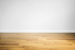 © SasinParaksa - Laminated wood floor with white wall