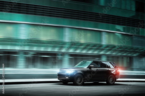 luxury-car-fast-drive-on-road-in-the-city