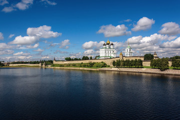 Wall Mural - View of the Pskov Kremlin from Velikaya River in the summer in a sunny weather