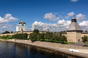 Wall Mural - View of the Pskov Kremlin from Velikaya River in the summer in a sunny weather