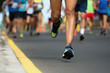 © pavel1964 - Marathon running race, people feet on city road