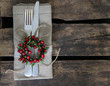 Christmas table place setting on rustic background