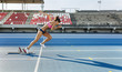 © Westend61 - Female athlete running on racetrack