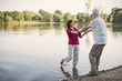 © Westend61 - Happy senior couple at a lake
