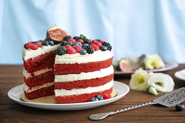 Poster - Tasty cake with berries on table