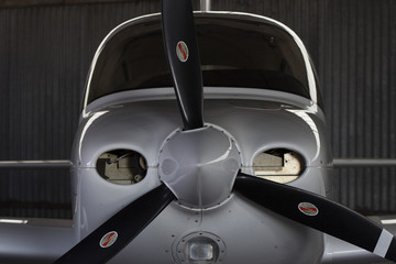 Cirrus SR20 light aircraft nicely contoured silhouette in a hangar