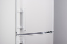 Close Up Of White Refrigerator On Gray