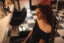 Woman Sitting At Hair Saloon