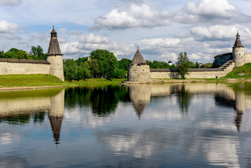 Wall Mural - View of the Pskov Kremlin from Velikaya River in the summer in a sunny weather