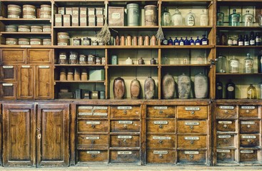 Bottles on the shelf in old pharmacy. Retro style.