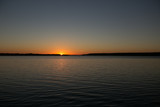 Fototapeta Miasto - Sunset on a calm lake in Ontario Canada
