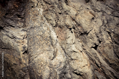 Stone background, rock wall backdrop with rough texture Canvas Print