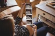© Wavebreak Media - Pregnant woman looking at a sonography in living room