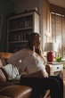 © Wavebreak Media - Pregnant woman relaxing in living room