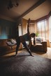 © Wavebreak Media - Pregnant woman performing stretching exercise in living room
