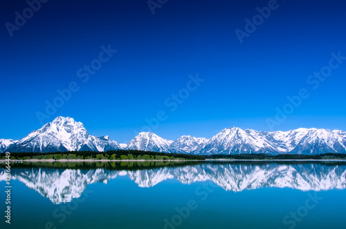 Fotografie, Obraz Grand Tetons reflecting in Jackson Lake Wyoming