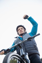 Excited Male Mountain Biker In Forest