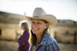 © Erickson Stock - Portrait of a smiling rancher wearing a cowboy hat while out on the ranch.