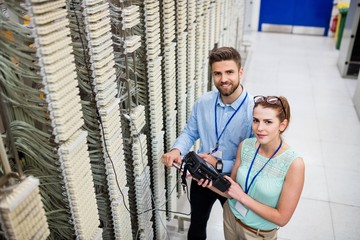 Fototapete - Technicians using digital cable analyzer