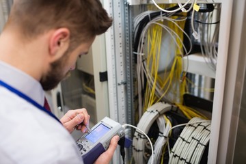 Fototapete - Technician using digital cable analyzer