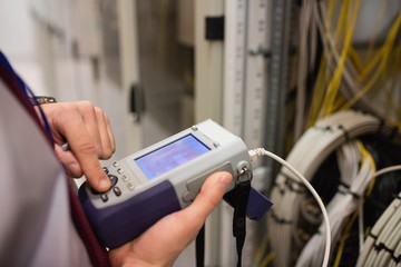 Fototapete - Technician using digital cable analyzer
