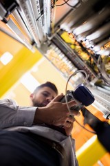 Fototapete - Technician using digital cable analyzer