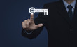 © grapestock - Businessman pressing copyright key icon on blue background, Copy