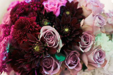 Wall Mural - Nice bouquet with the purple roses on the wedding table