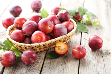 Sticker - Fresh plums on a grey wooden table