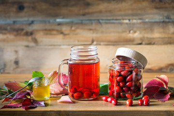 Rosehip tea and berries with honey