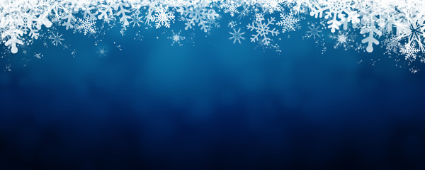 blue winter background with snow and snowflackes.
