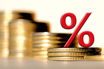 	Red percent sign on a background of money . The concept of changes in market prices .