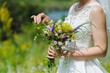 Bride with a bouquet of wildflowers