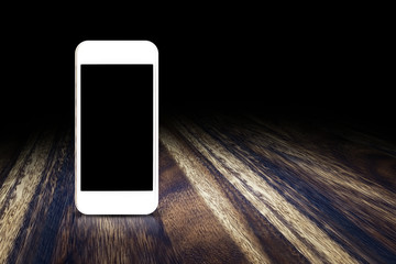 Wall Mural - mobile phone on dark brown wood floor perspective background for