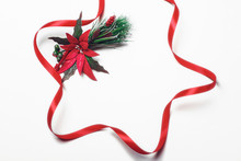 Christmas Holiday Background With Red Poinsettia Flower Decoration And Ribbon