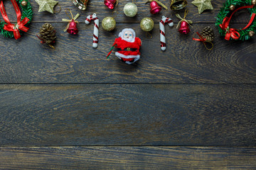 Wall Mural - Top view Christmas decoration and Santa Claus doll on wooden.