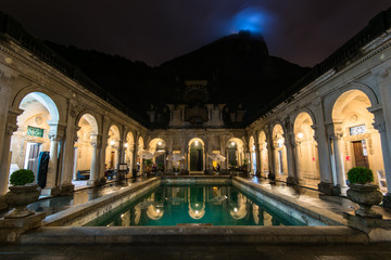Fototapete - Colonial Italian architecture Lage palace at night with the Corcovado mountain behind