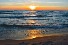Brilliant Sunrise Over The Waters Of Lake Huron In Oscoda, Michigan