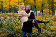 © Fxquadro - Redhead male holds in his arms cute blonde female.