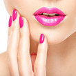 © Valua Vitaly - Closeup woman hand with pink nails near lips.