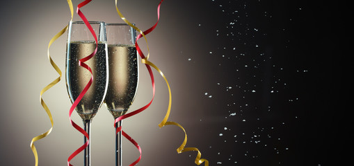 Two glasses with sparkling champagne and decorative ribbons closeup