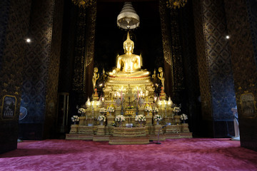 Beautiful of golden Buddha statue and thai art architecture in Wat Bovoranives, Bangkok, Thailand.