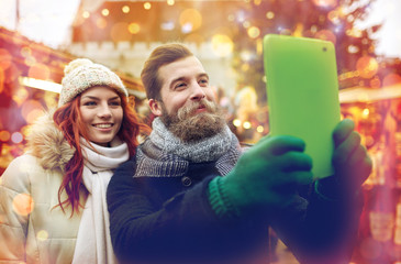 Wall Mural - couple taking selfie with tablet pc in old town