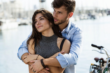 Portrait of happy young couple in love in the city.