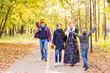 © satura_ - Happy young family spending time together outside in autumn nature.