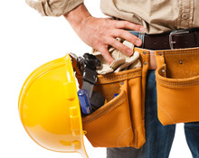 Close Up Construction Worker Contractor Carpenter Tradesman Tool Belt Hard Hat  Isolated On White Background For Use Alone Or As A Design Element