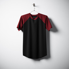 Sticker - Blank black and red cotton tshirt hanging in center of empty concrete wall. Clear label mockup with highly detailed textured materials. Square. Front side view. 3D rendering.