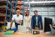 © WavebreakmediaMicro - Portrait of warehouse managers and worker working together